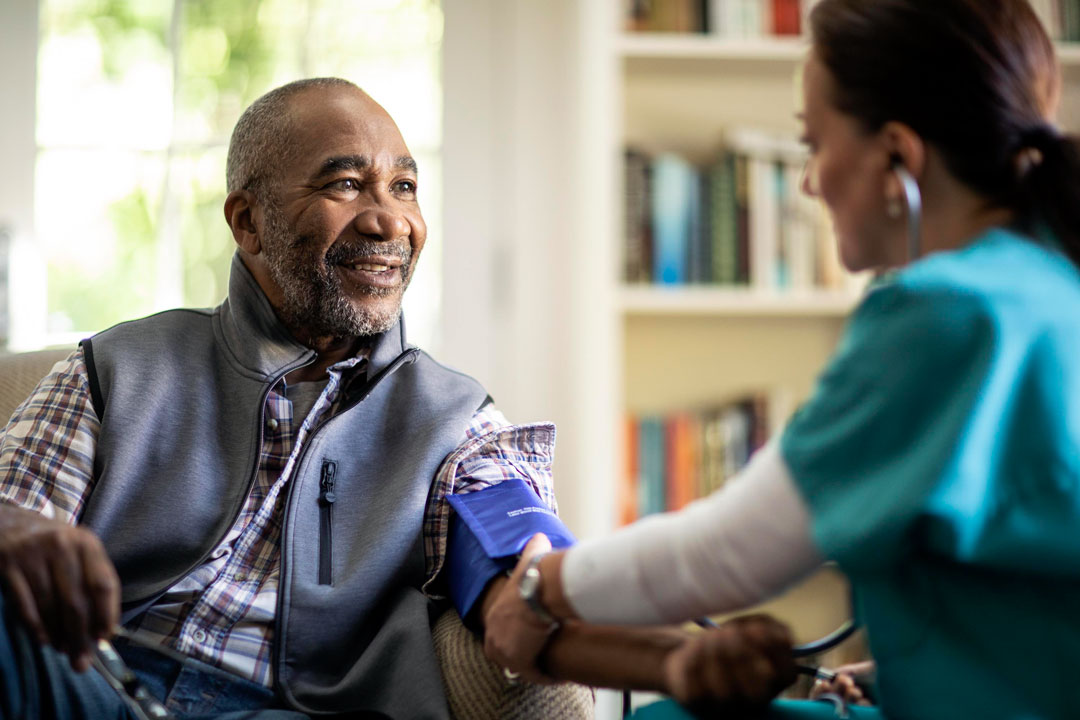 housecalls physician examining patient at home